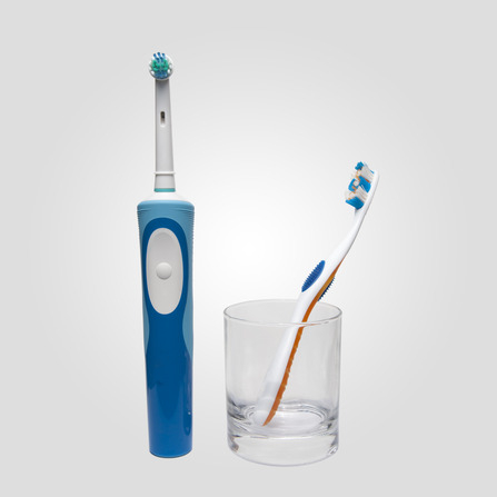 photodune 6929277 electric toothbrush and traditional toothbrush in a glass xs 1